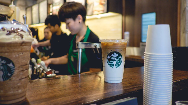 Starbucks baristas preparing drinks