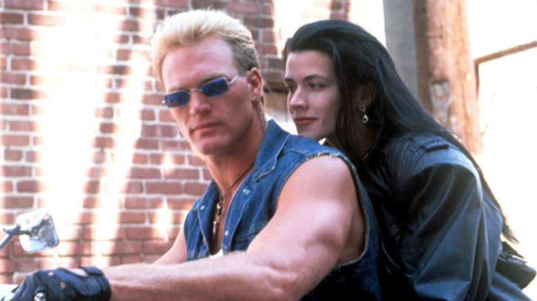 Joe Huff and Nancy riding motorcycle