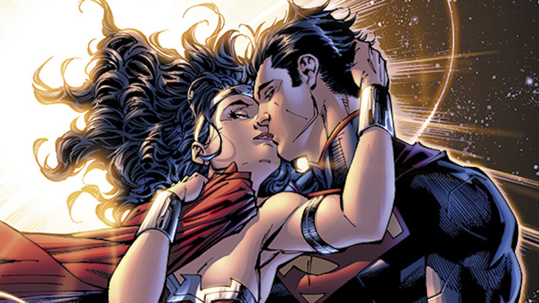 Superman and Wonder Woman kiss