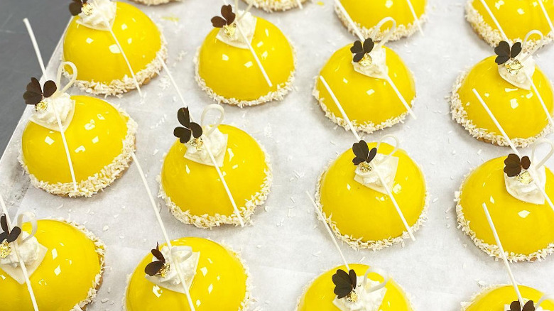 yuzu mango desserts lined up on wax paper